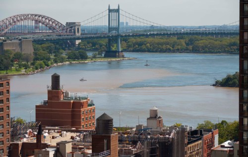 Coast Guard boat investigates about four hours after the start of the ebb in the East River