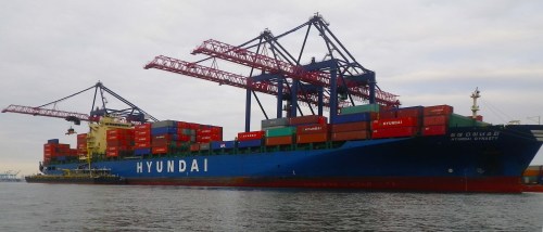 Loading a container ship in New York Harbor (photo by Vlad)
