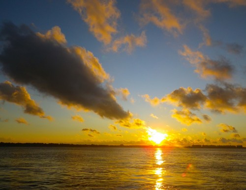Sunrise breaking through the clouds over Coney Island