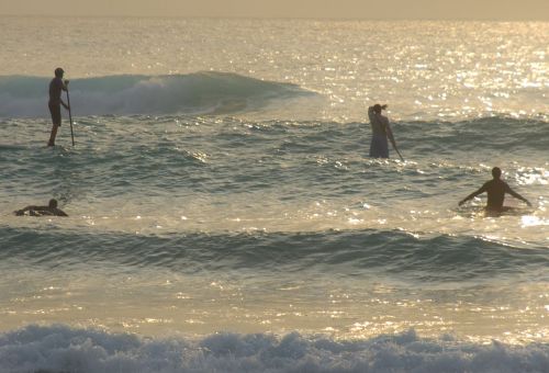Surfing at dawn at Glover's Reef Atoll, Belize