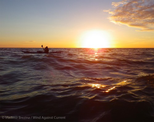 Paddling past the sunset