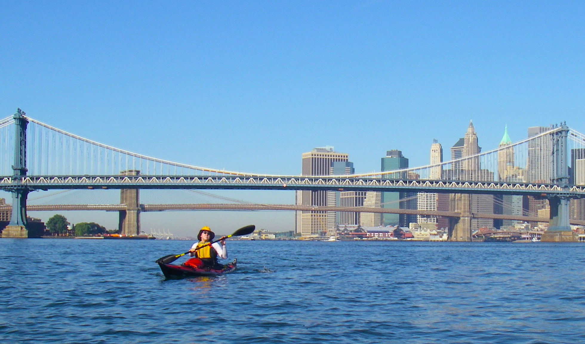 vlad-smiling-with-paddles-and-bridge-cropped